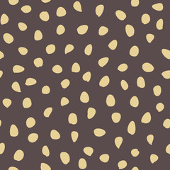 Seamless vector background with random elements. Abstract ornament. Dotted abstract brown and golden pattern
