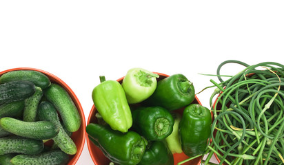 green peppers, cucumbers and garlic in a bowl