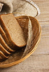 slices of rye bread and ears of corn in basket