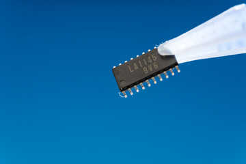 Tweezers and electronics chip