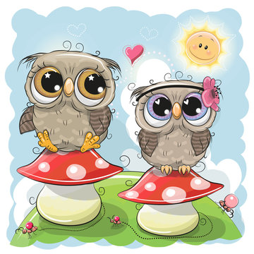 Two Cute Owls are sitting on mushrooms