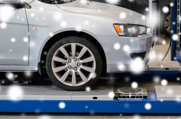 Fototapeta premium car on lift at repair station