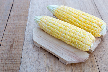 Sweet corn on wood table.