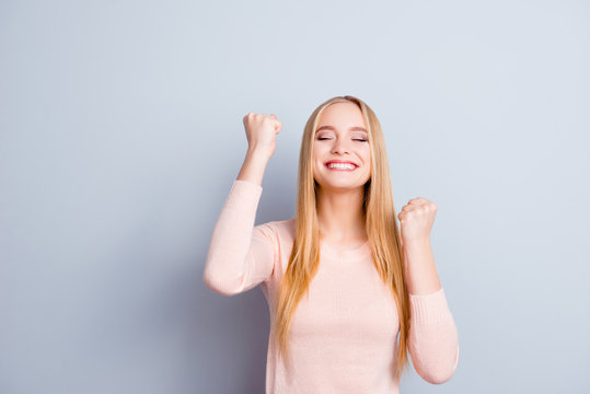 Teen age people business freelancer glad desire employee luck youth concept. Portrait of pretty cute cheerful excited emotional employee raising arms up celebrating fortune isolated on gray background