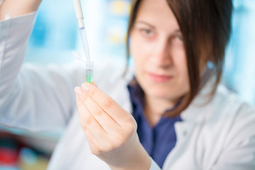 young woman lab assistant in a genetics lab