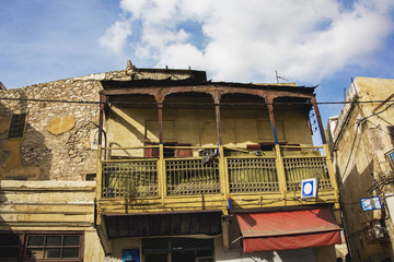 view of an ancient and broken house in the heart of a city of morocco