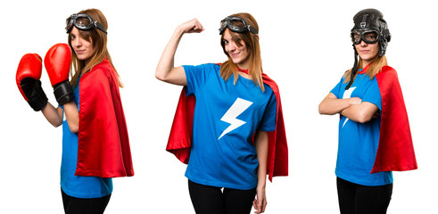 Pretty superhero girl making strong gesture © luismolinero
