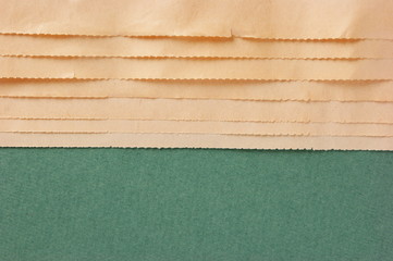 edge of the old newspaper on a green background