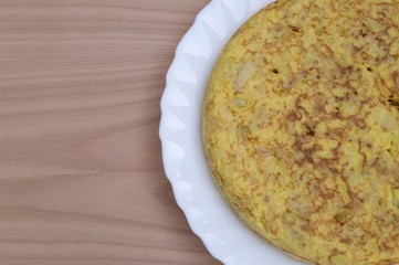 Spanish potato omelet on wooden background