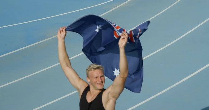 An Athlete celebrates with the National Flag of Australia.