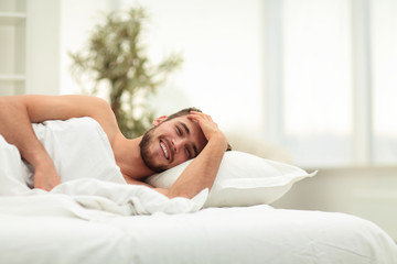 Fototapeta na wymiar business man resting in a comfortable hotel room