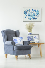Comfy armchair in white room