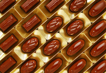 chocolate candies in a gold gift box