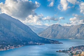 Montenegro. View of the mountains, the city and the bay of Kotor from a height at sunset.