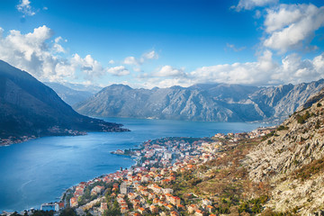 Obraz premium Montenegro. View of the mountains, the city and the bay of Kotor from a height at sunset.