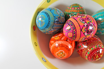 Hand painted Easter eggs on a plate. Traditional Czech easter eggs.