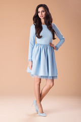 Beautiful fashionable woman in nice dress, handbag and accessories. Fashion spring summer photo