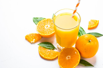 Orange juice in glass on white.