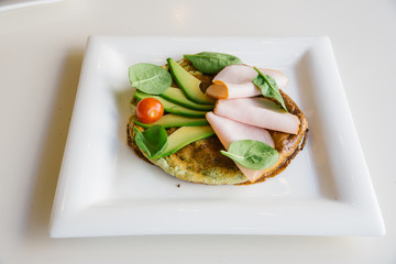 vegetables, greens on a square plate