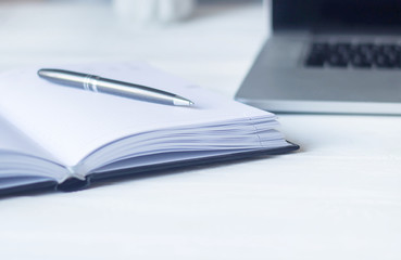 laptop and documents in the workplace.