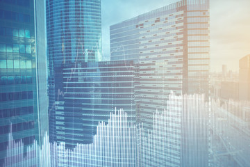 Double explosure with business charts and financial district.
