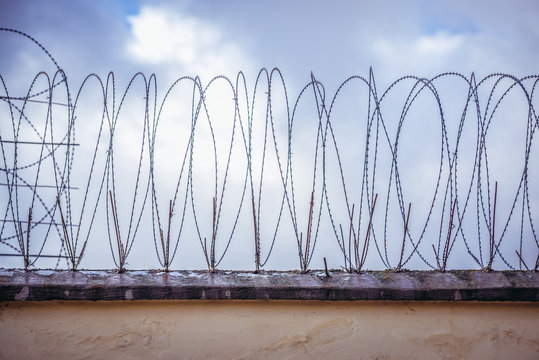 Prison wall with barbed wire in Poland