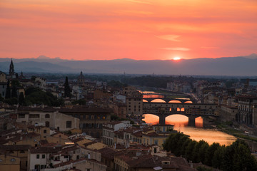 Famous bridges over the Arno river in Florence, Italy, at the dawn of the sun. Fantastic romantic...