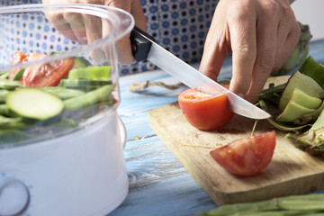 man cooking with a steam cooker
