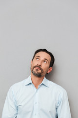 Portrait of a pensive mature man dressed in shirt