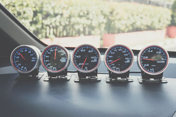 Instrument panel and tachometer from a modern high performance automobile.