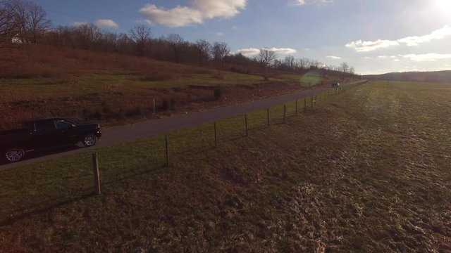 Aerial Rural Winter Black Truck Fly Over Boom Up 2