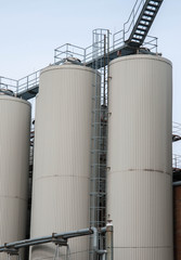 Production. Industrial buildings in the blue sky
