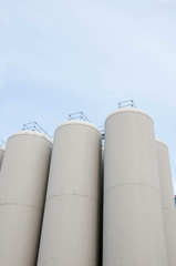 Production. Industrial buildings in the blue sky
