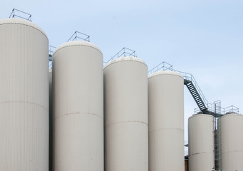 Production. Industrial buildings in the blue sky
