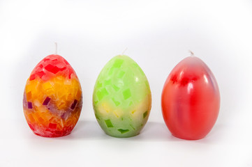 Three beautiful holiday candles. Close-up
