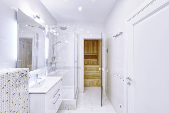 The interior of the bathroom in white modern house.