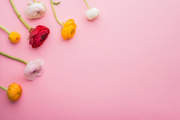 Easter and spring flat lay on a pink background.