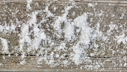 snow on wooden texture background