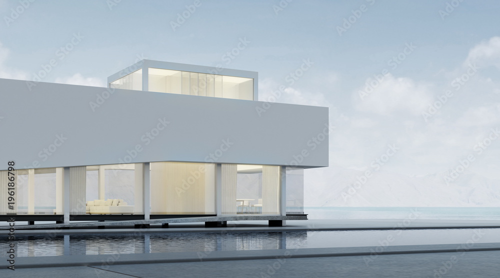 Poster 3D rendering of modern architecture with warm interior lighting and minimal pool on mountain background,Concept of design architectural.	