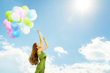 Woman Flying on Balloons , Happy Girl with Colorful Air Balloon Bunch Fly over Sunny Blue Sky Background