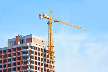 Crane and highrise construction site