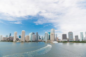 Aerial view of Miami skyscrapers with blue cloudy sky