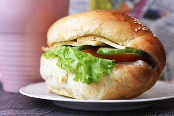 Cheeseburger with fresh herbs, delicious fast food