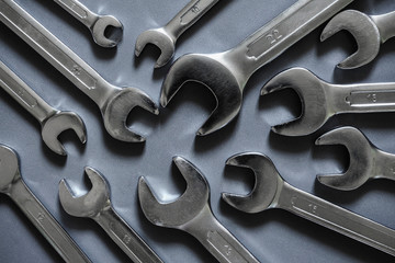 Set of tools for repairing spanners on a gray background with copy space flat lay top view