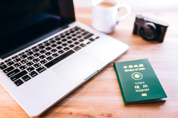Taiwan passport, Computer and camera on wood table