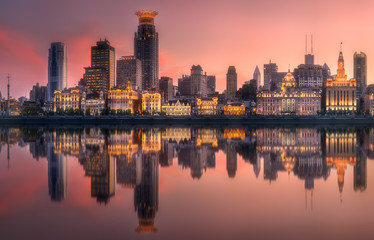 Fototapeta na wymiar Shanghai skyline with reflection of sun on water