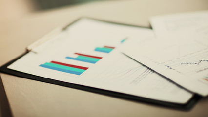 financial charts and graphs on the table