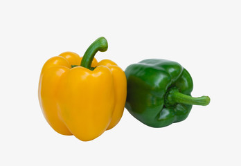 Green and yellow sweet bell pepper isolated on white background, close up.