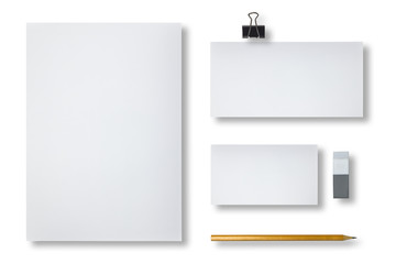 Blank letterhead, business cards, envelope and pencil, isolated on white background. Top view.