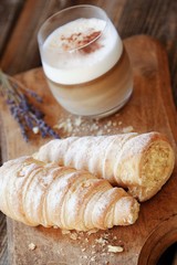 Delicious vanilla cream cakes and lavender coffee